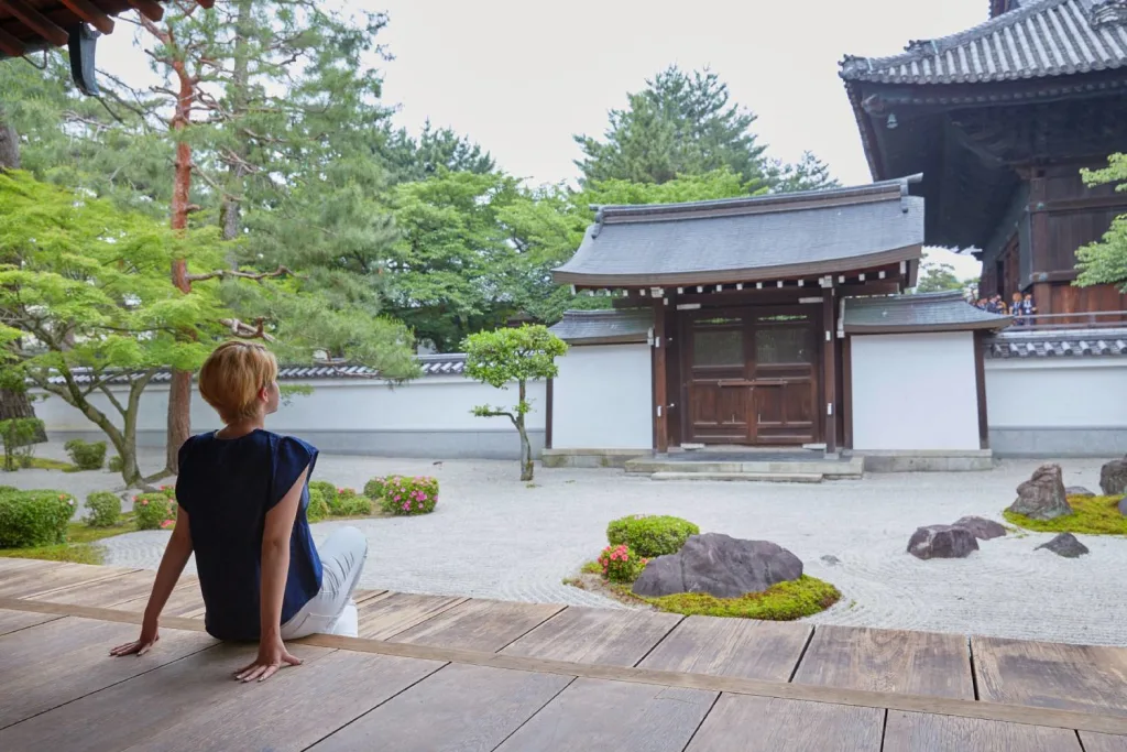 Peaceful moment of woman tourist at Japanese temple